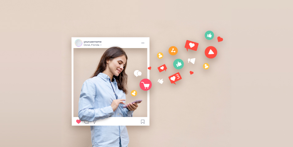 A woman is holding a phone displaying social media icons.